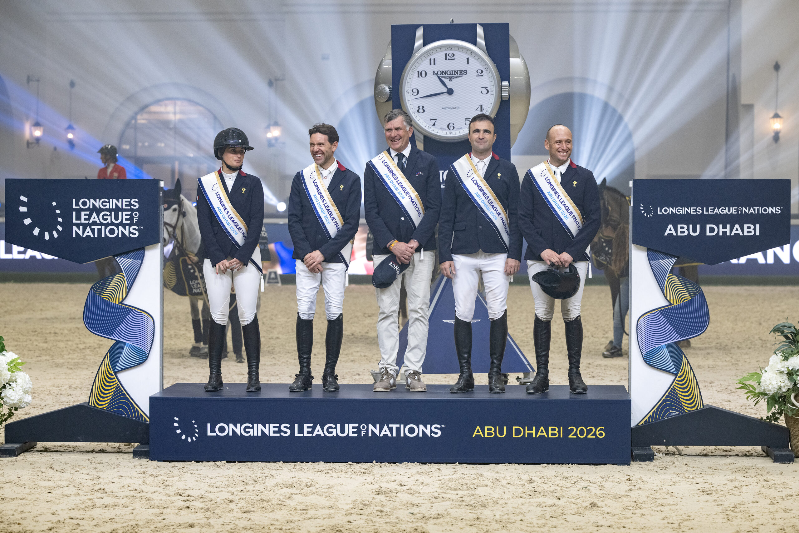 Shiny happy people on the League of Nations podium in Abu Dhabi with Jeanne Sadran, who only competed in the first round, Simon Delestre, Olivier Perreau and Nicolas Sers around team boss Edouard Couperie. Photo: FEI